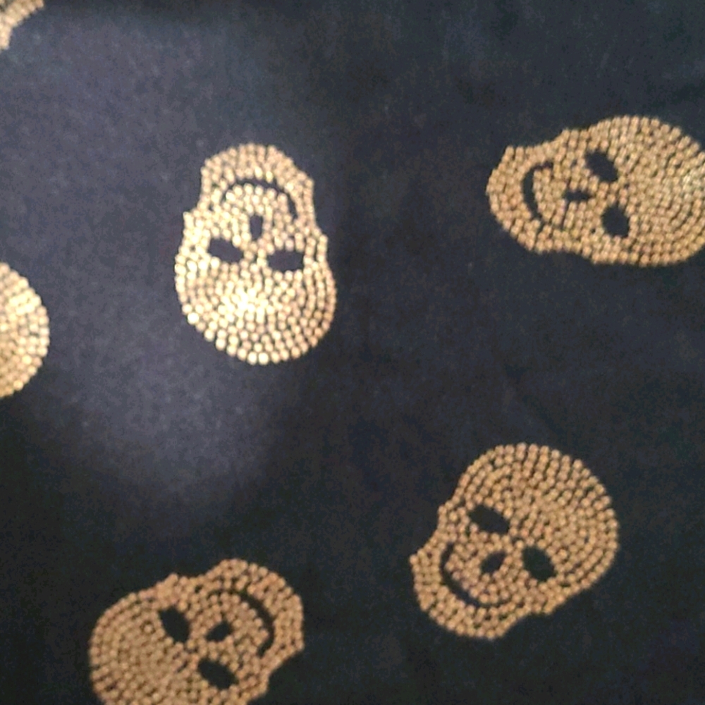 Midi black skirt with gold skull print